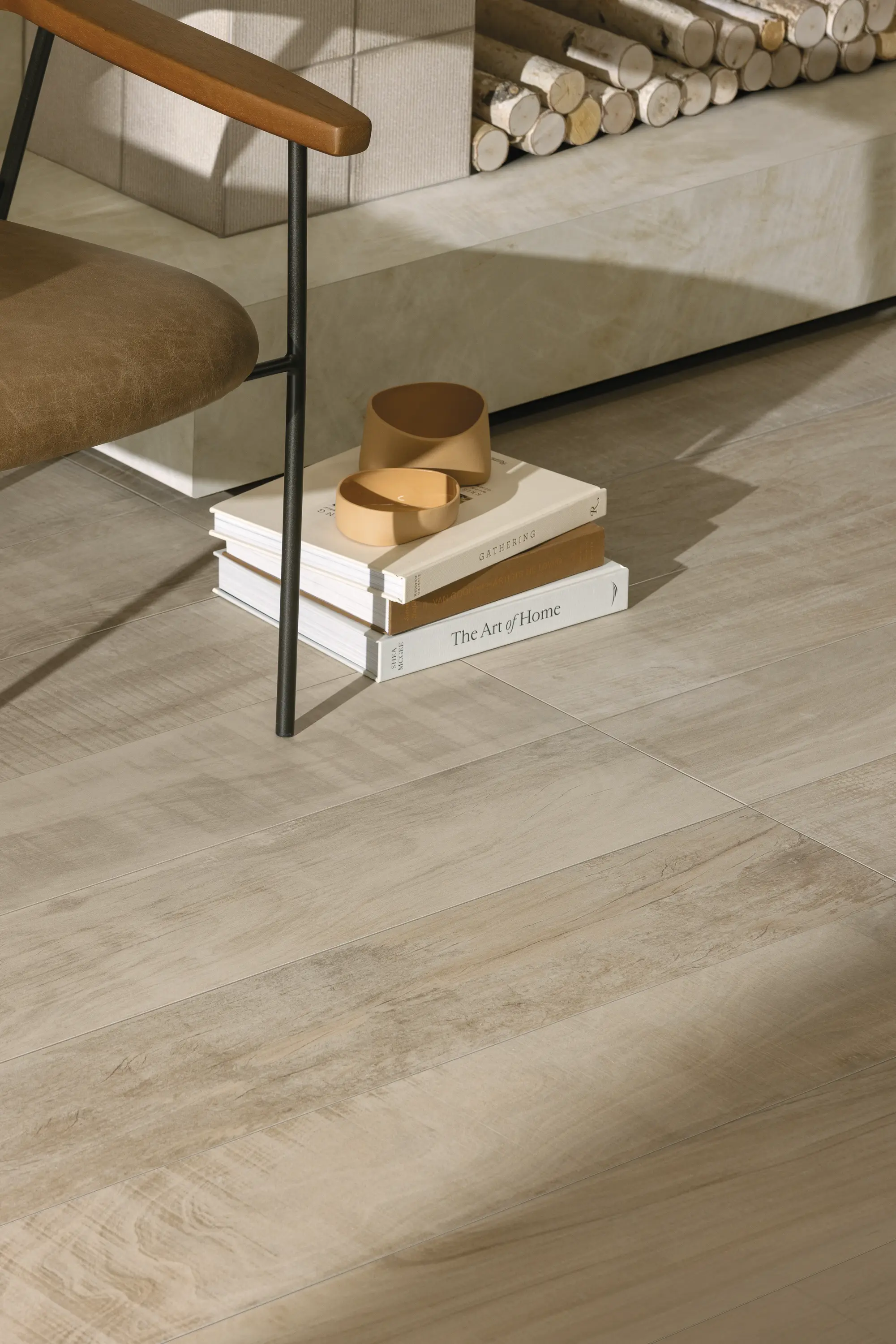 Wood-look floor tiles with books and decorative objects