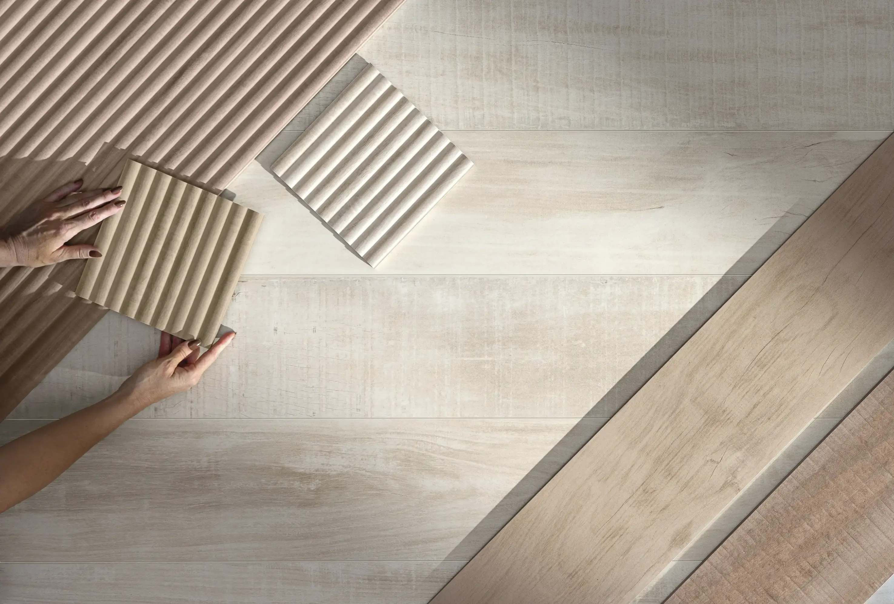 Tile sample with striped texture placed on a neutral surface