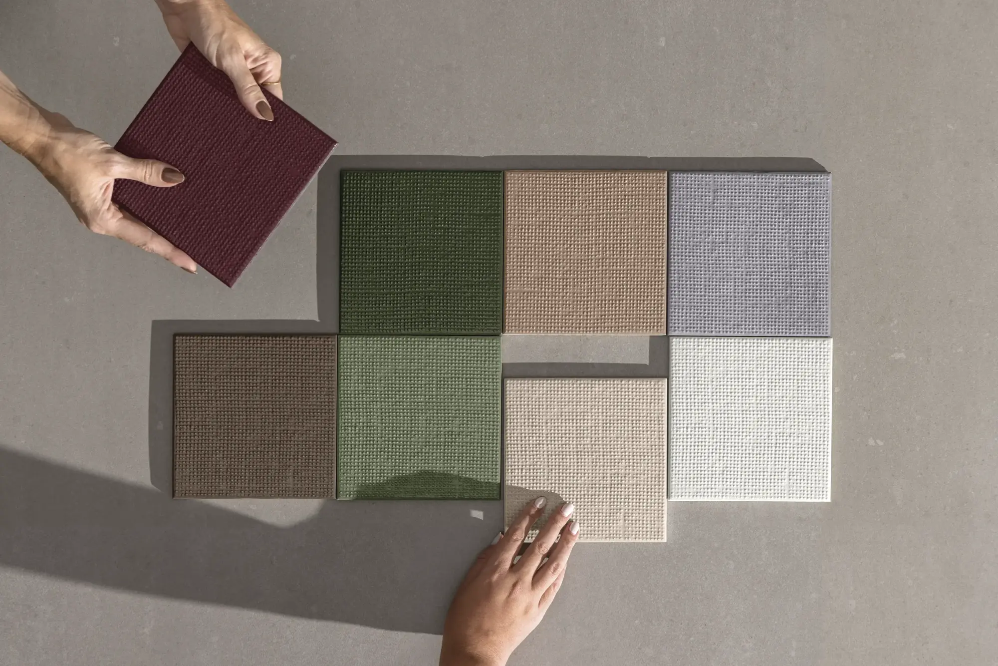 Loom tile samples in multiple colors being compared