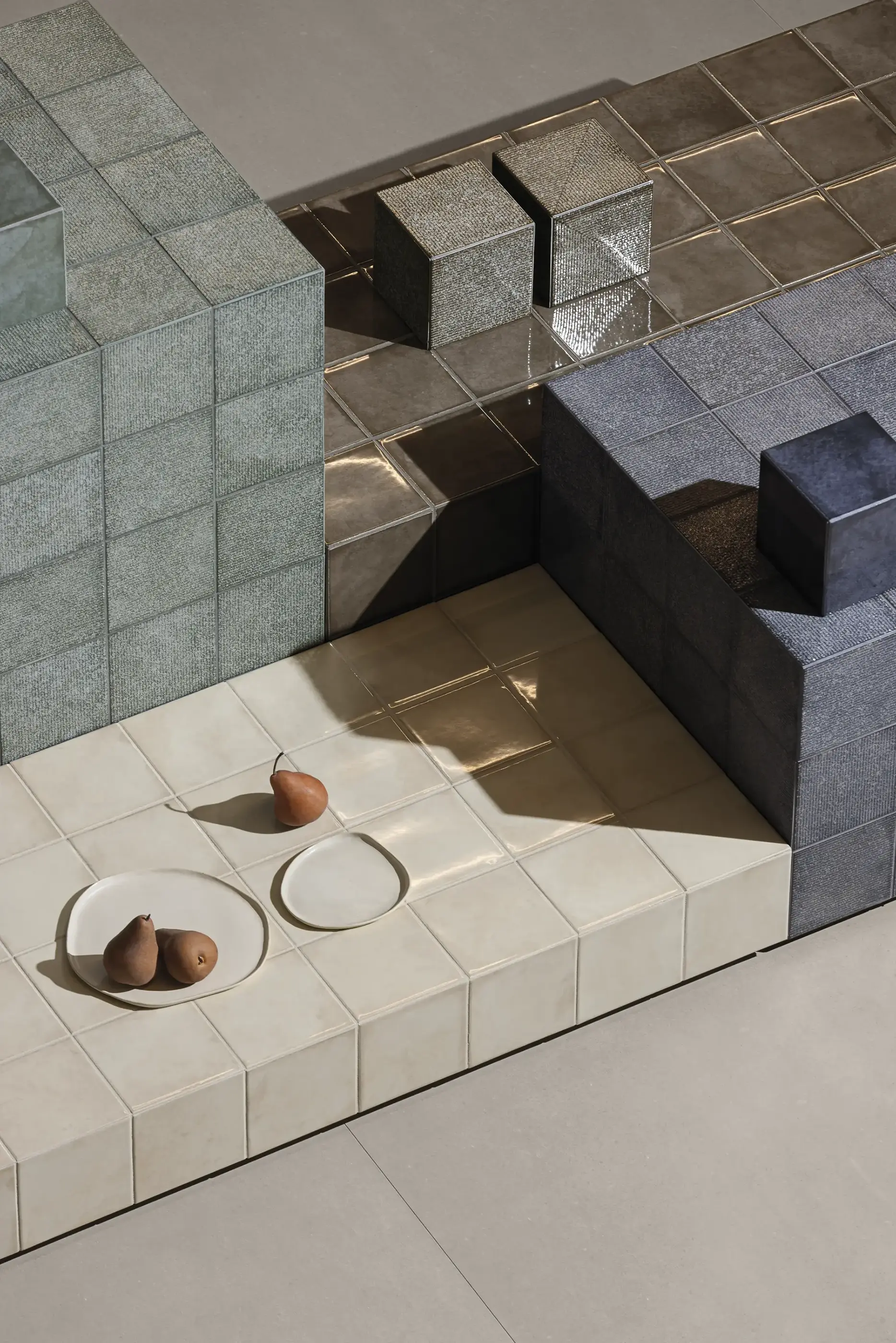 Light square tiles used on a countertop with decorative objects