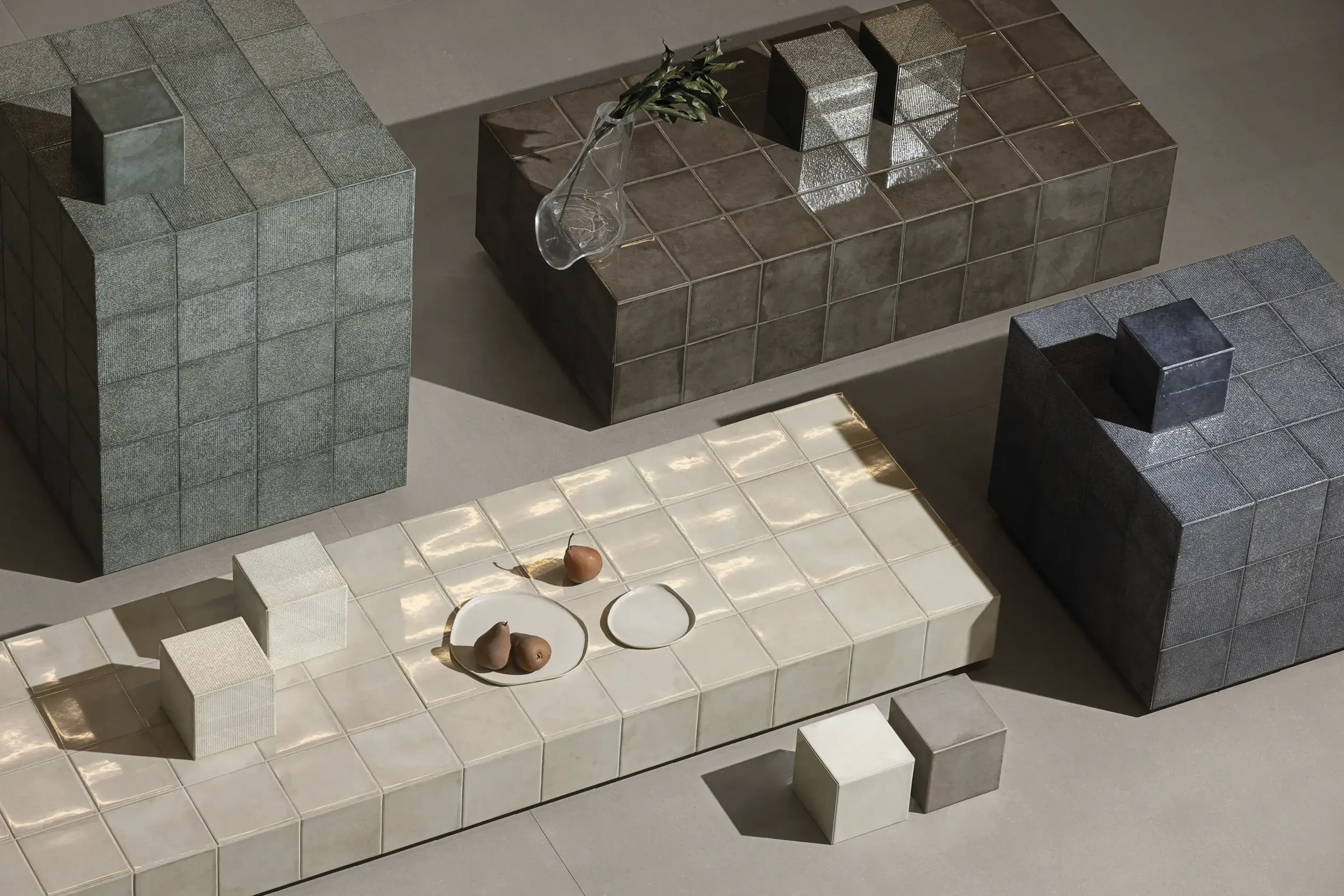 Light square tiles used on a countertop with decorative objects