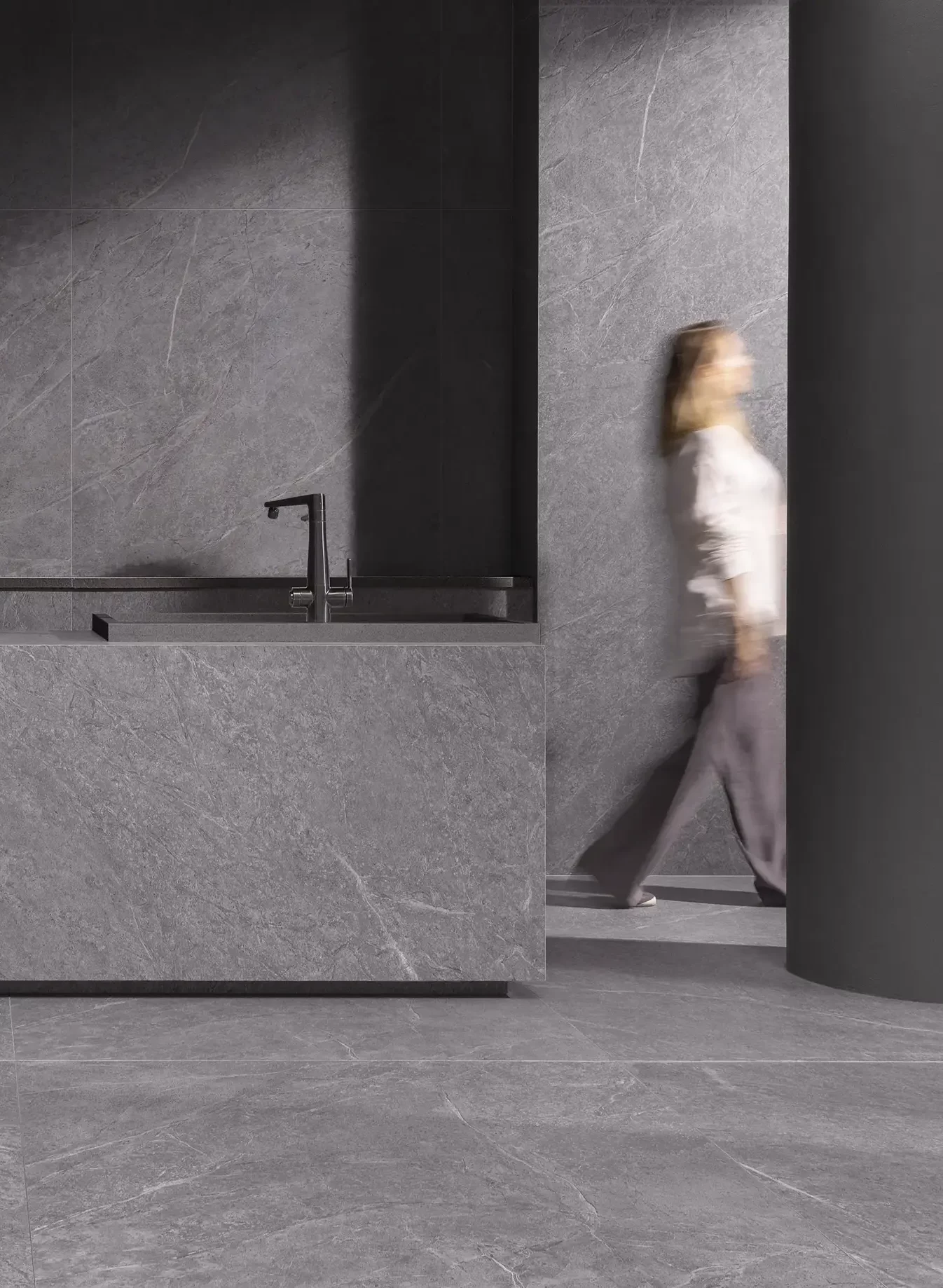 Dark gray stone-look tiles in a modern kitchen interior