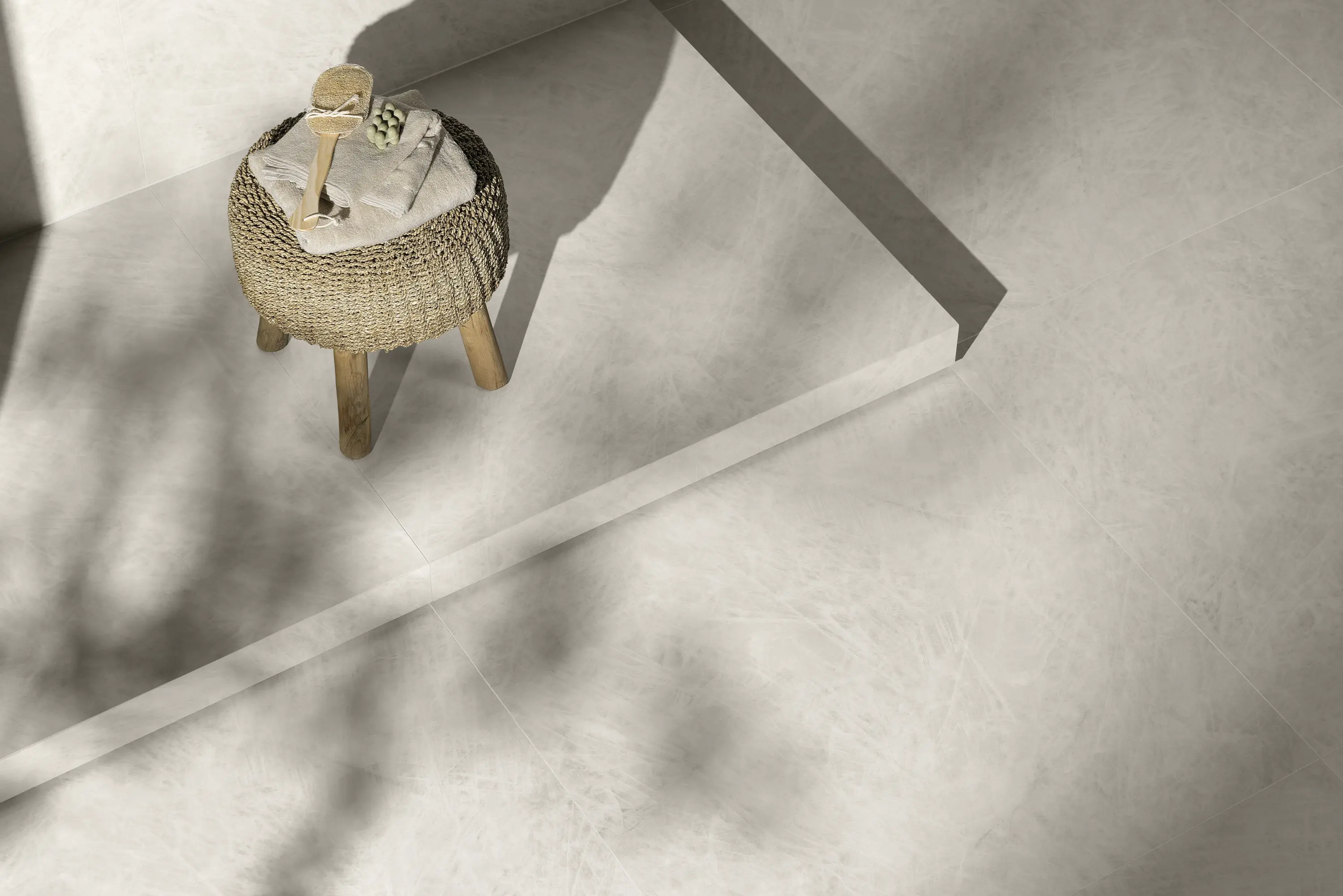 Light surface with soft shadows and small stool in a sunlit composition - Cirstallo Bianco